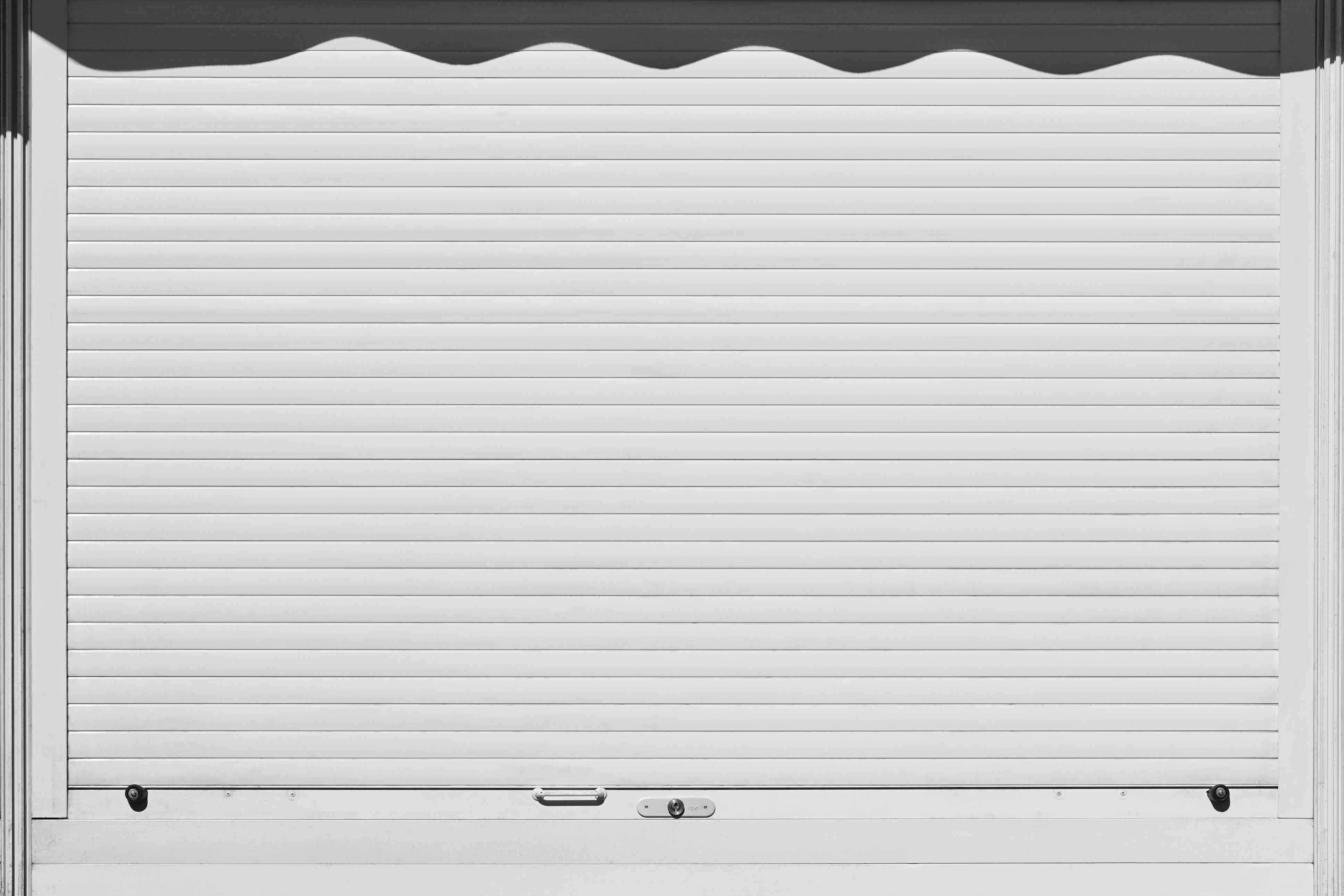 Concerned about Garage Door Prices? Read this... image closed and locked white rolling shutter security b PN9GDGN1