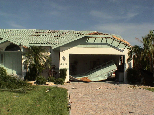 Top Garage Door Repairs image damaged car large